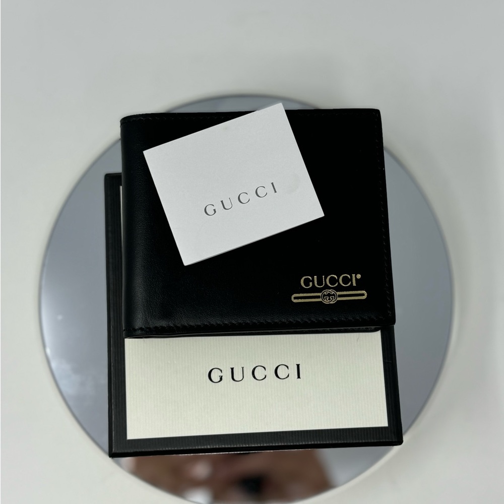 Gucci Black Leather Gold Embossed GG Logo Bifold Wallet. $460 - Picture 2 of 6